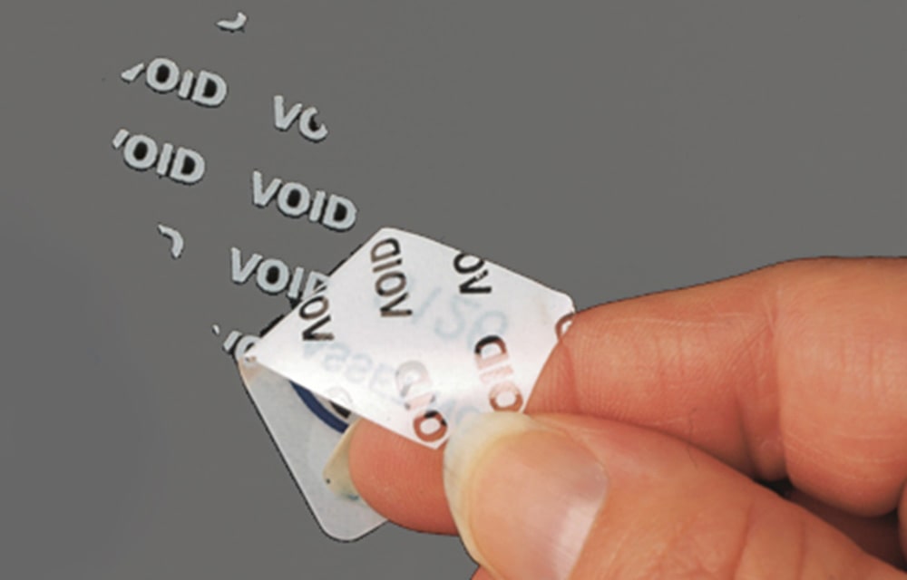 Tamper evident tape with grey background and void showing